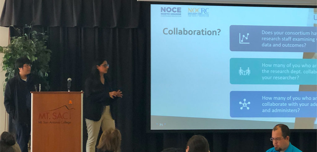 NOCRC Research team presenting data findings at a conference. 
